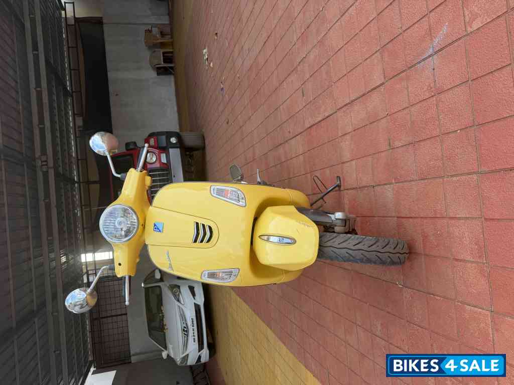 Yellow Vespa ZX 125