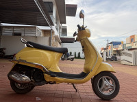 Yellow Vespa ZX 125