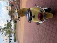 Yellow Vespa ZX 125