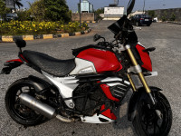 Red And White Mahindra Mojo