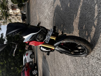 Red And White Mahindra Mojo