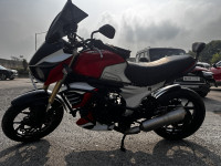 Red And White Mahindra Mojo
