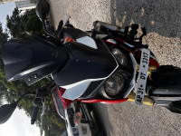 Red And White Mahindra Mojo