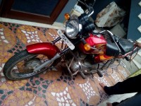 Red Bajaj Caliber