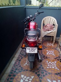 Red Bajaj Caliber