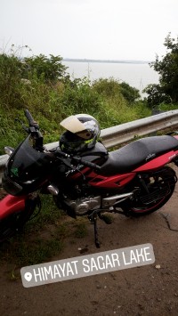 Red/black Bajaj Pulsar 150 DTSi