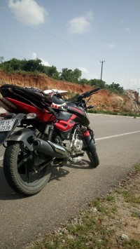 Red/black Bajaj Pulsar 150 DTSi
