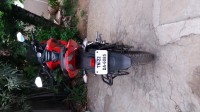 Red Bajaj Pulsar AS 150