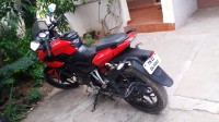 Red Bajaj Pulsar AS 150