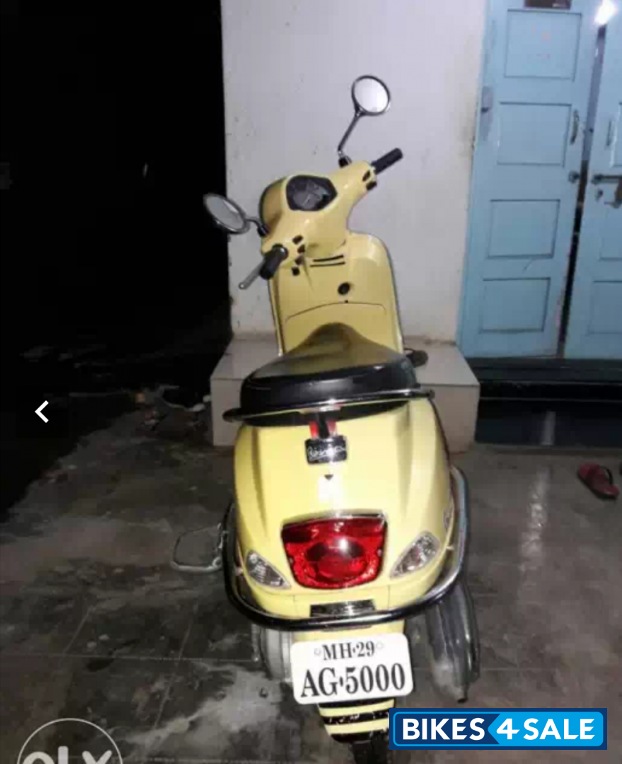 Yellow Vespa LX 125