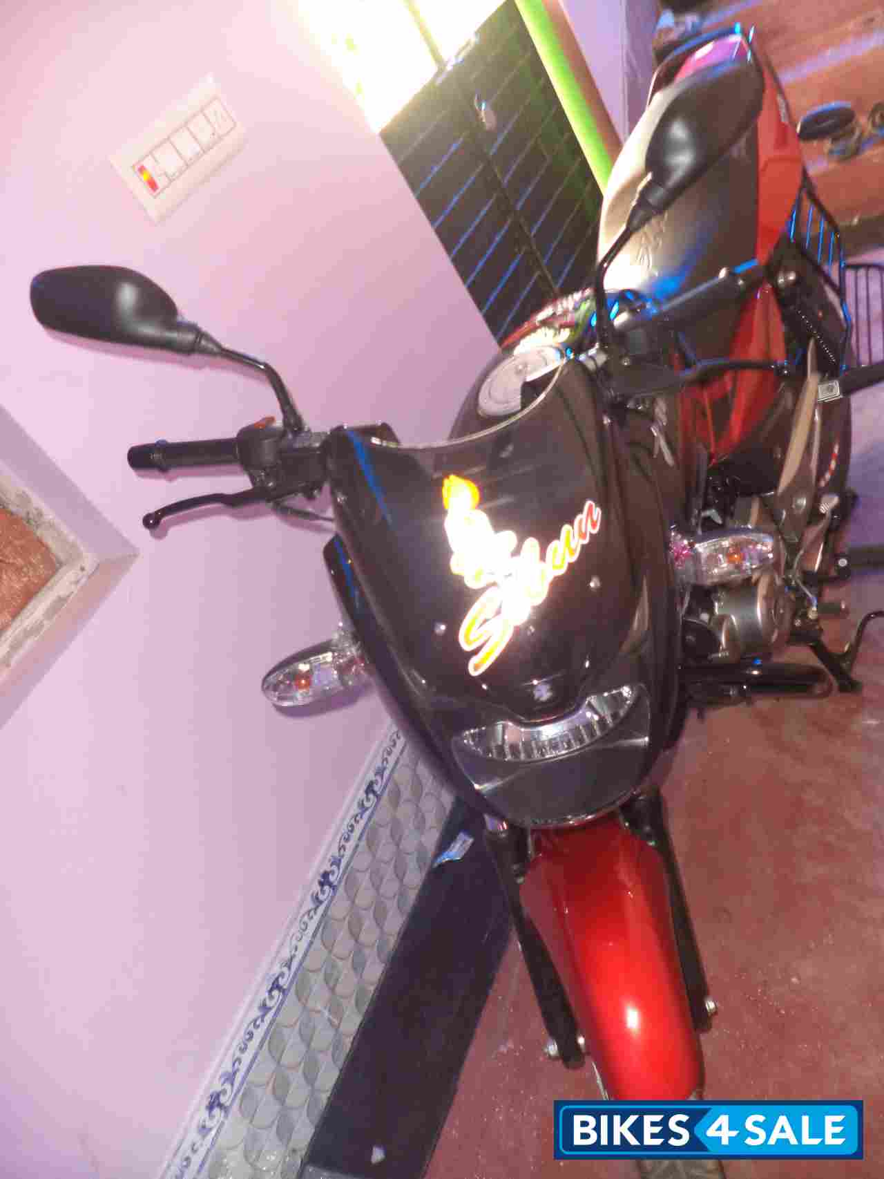 Red-black Bajaj Pulsar 150 DTSi