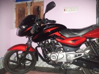 Red-black Bajaj Pulsar 150 DTSi