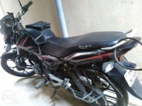 Red-black Bajaj Discover 100M