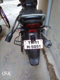 Red-black Bajaj Discover 100M