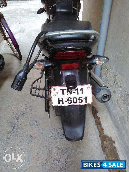 Red-black Bajaj Discover 100M