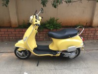 Yellow Vespa VXL 150