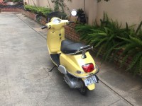 Yellow Vespa VXL 150