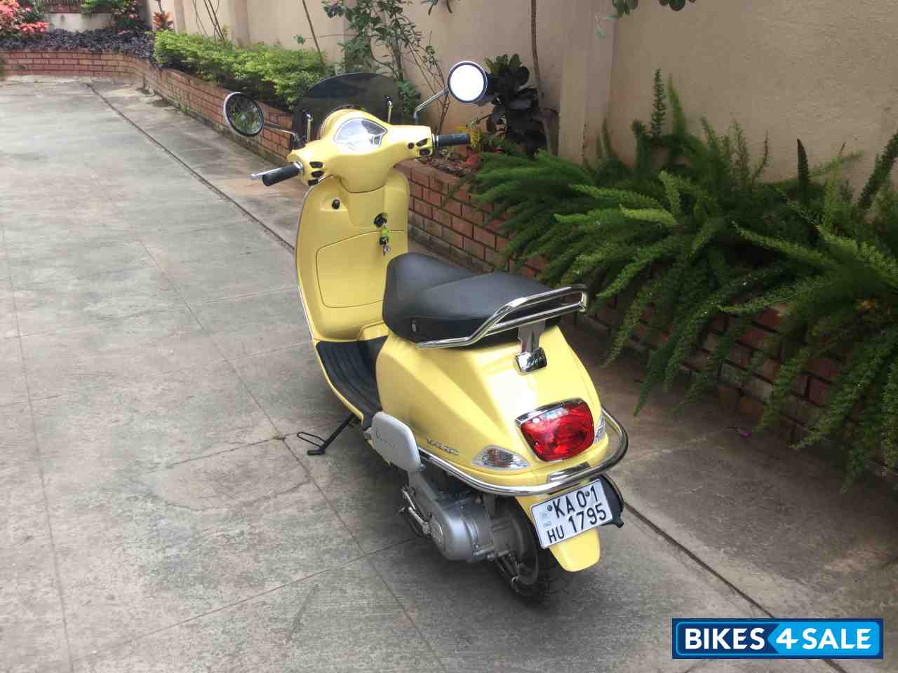 Yellow Vespa VXL 150