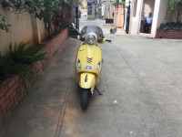 Yellow Vespa VXL 150