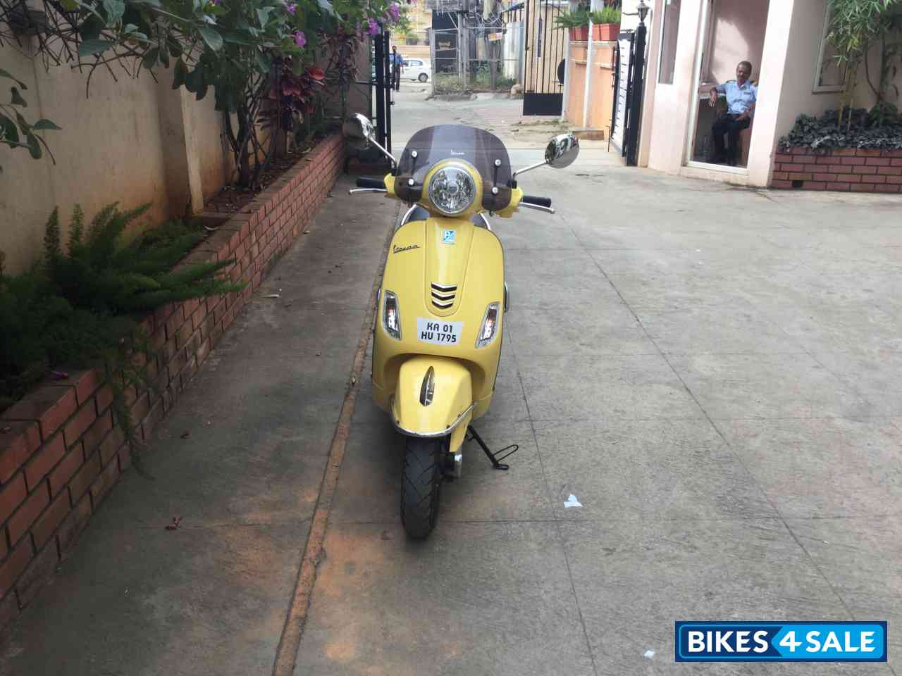 Yellow Vespa VXL 150