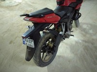 Red Bajaj Pulsar AS 200