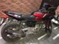 Red Bajaj Pulsar AS 200