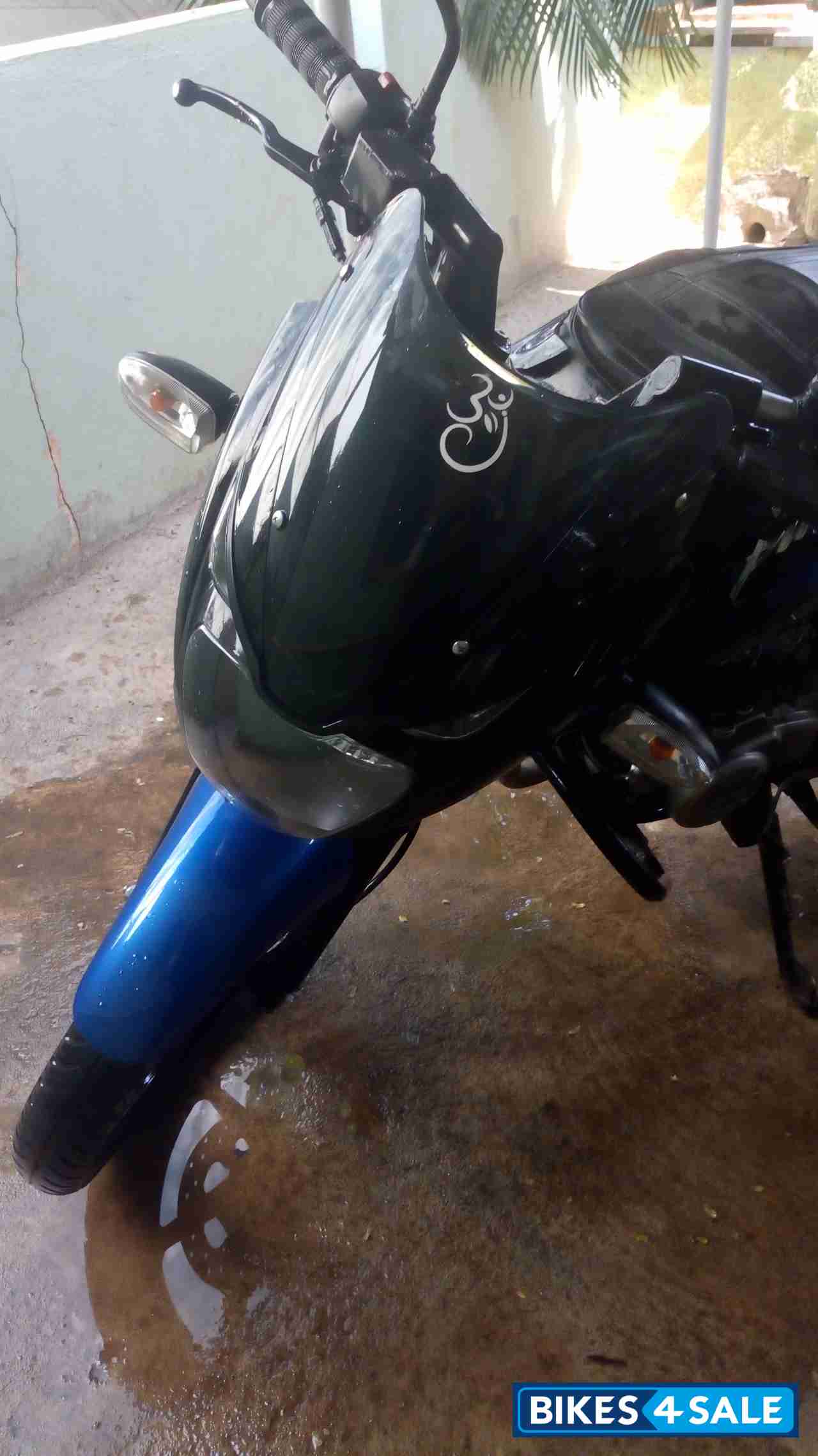 Black-blue Bajaj Pulsar 150 DTSi