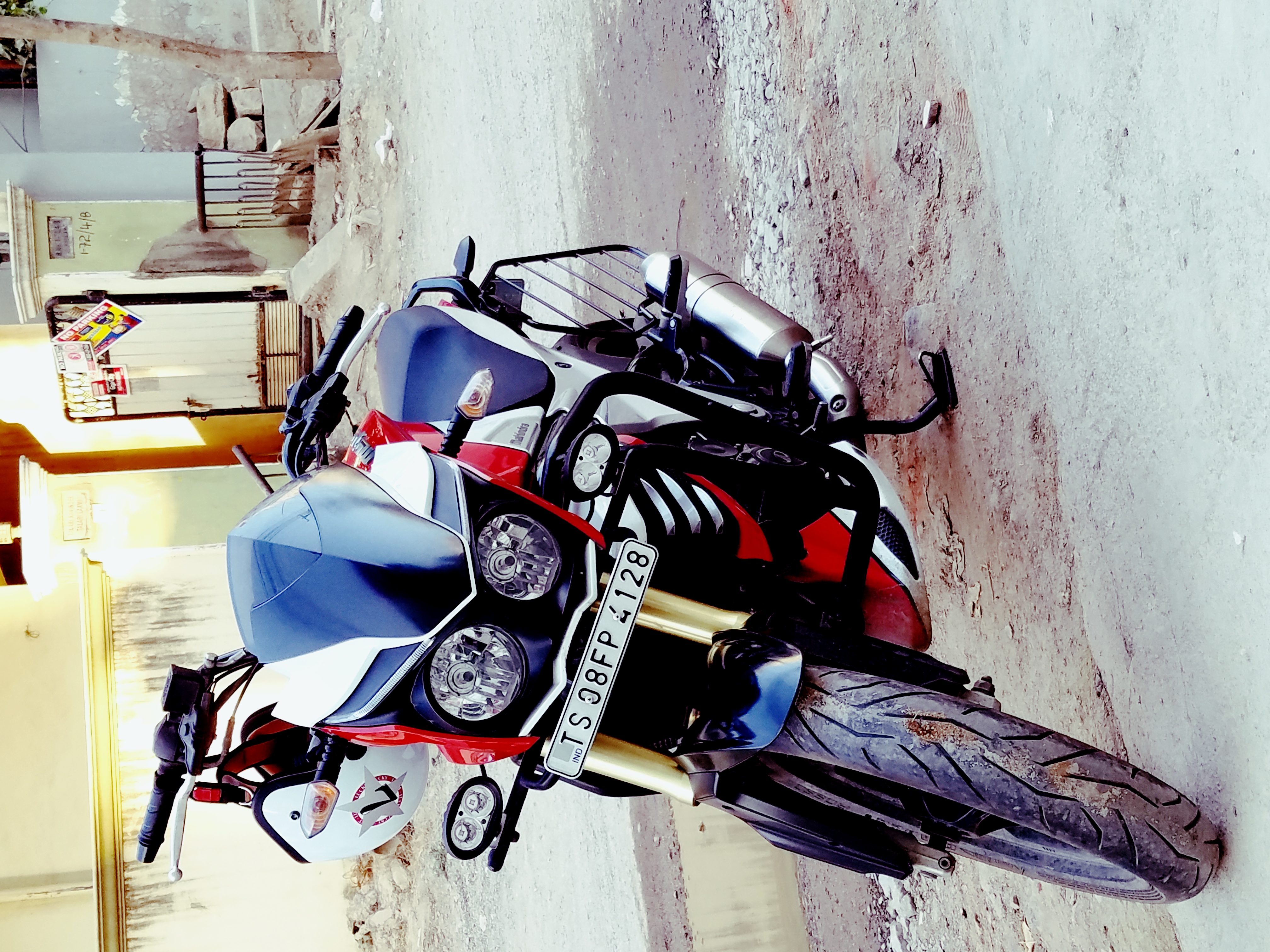 Red And White Mahindra Mojo