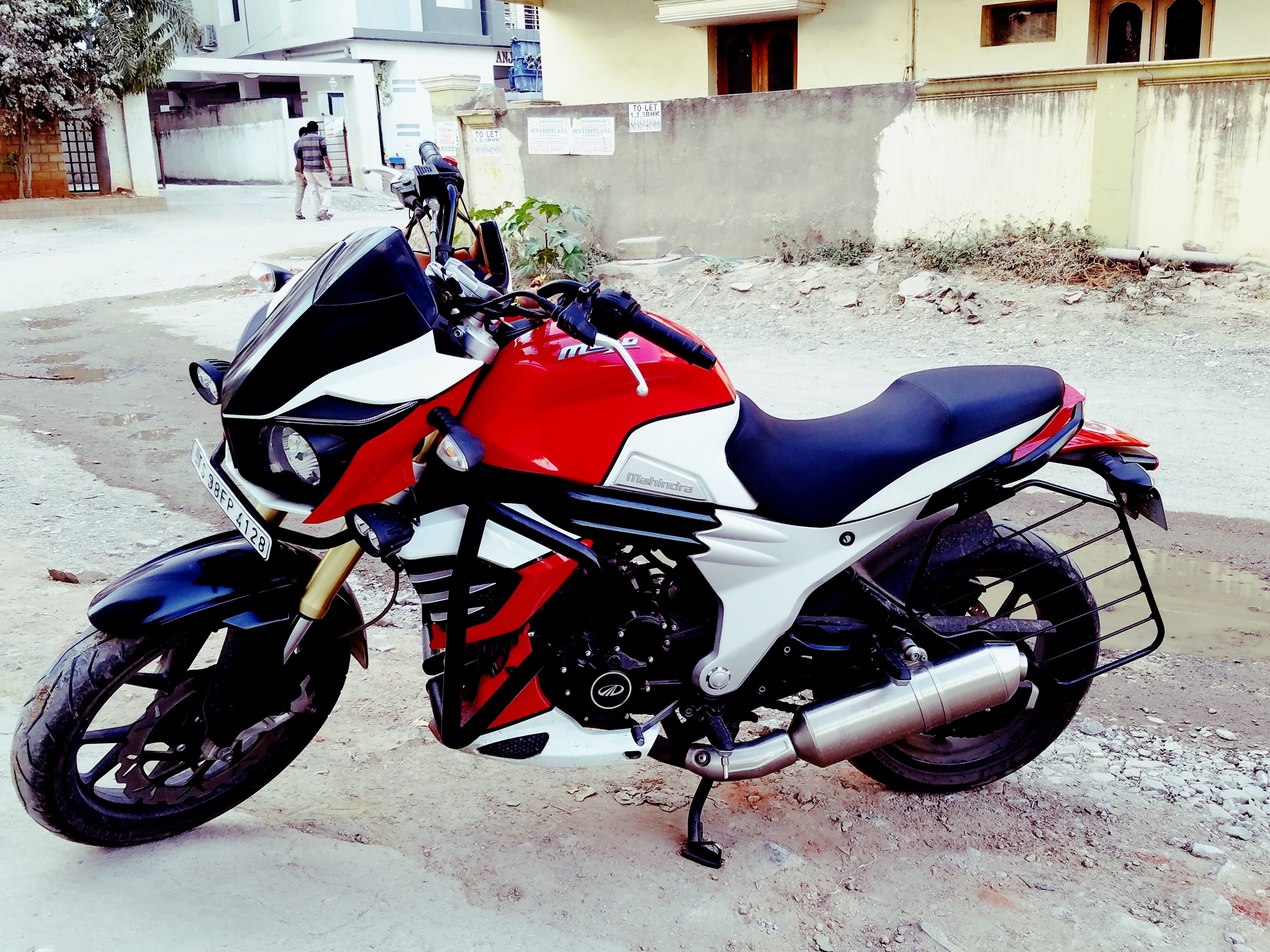 Red And White Mahindra Mojo