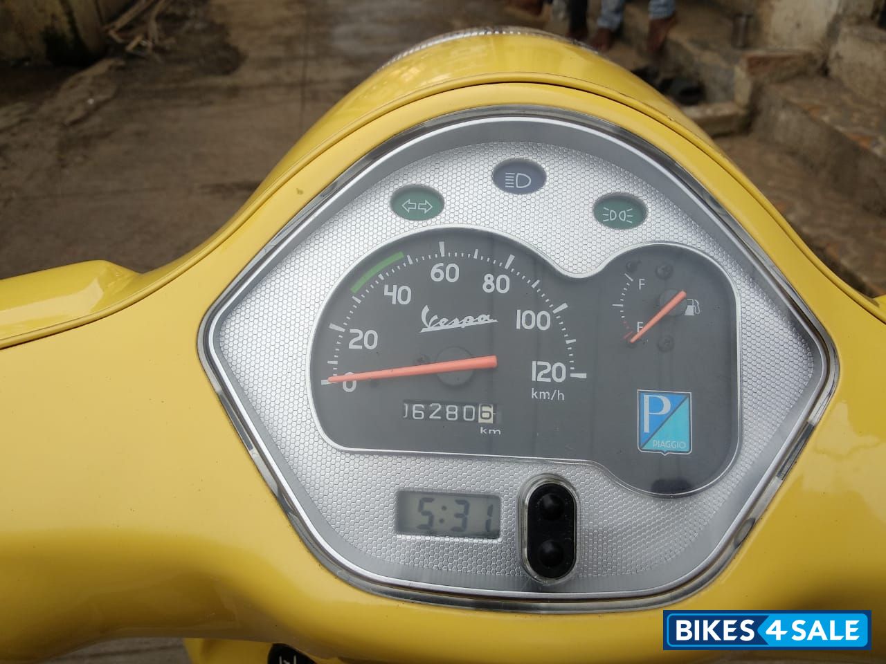 Yellow Vespa VX 125