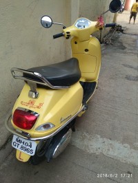 Yellow Vespa VX 125