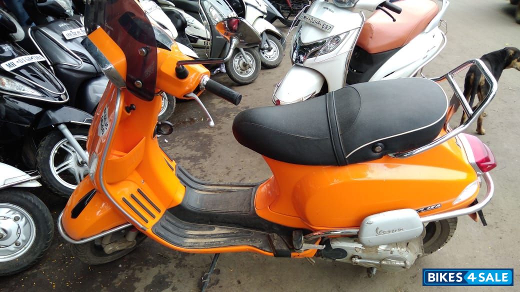 Orange Vespa SXL 150