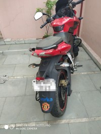 Red Bajaj Pulsar AS 200