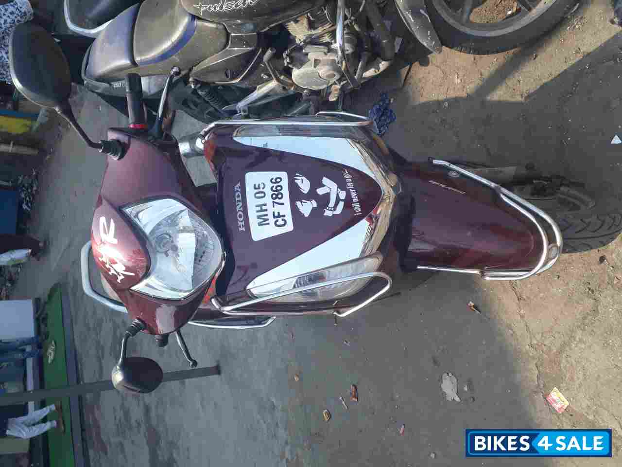Maroon Honda Aviator