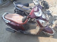 Maroon Honda Aviator