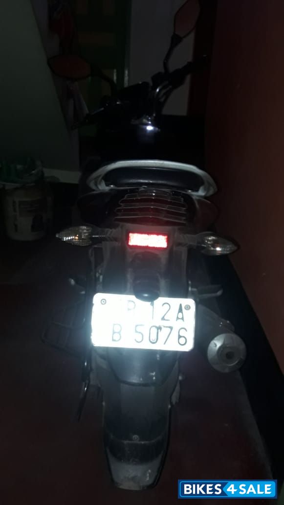 Black & Red Bajaj Discover 125 ST