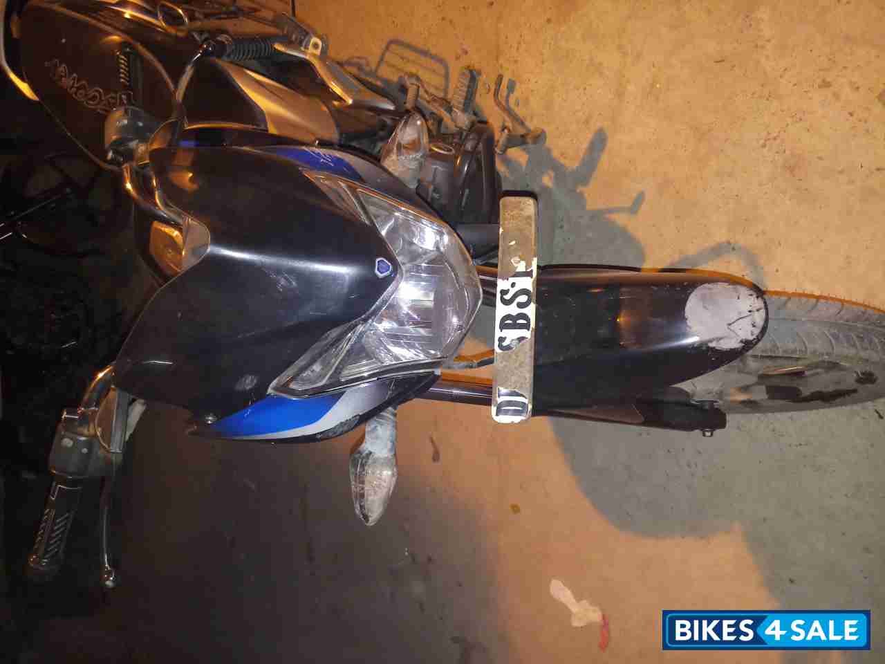 Black-blue Bajaj Discover 100T