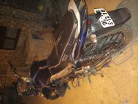 Black-blue Bajaj Discover 100T