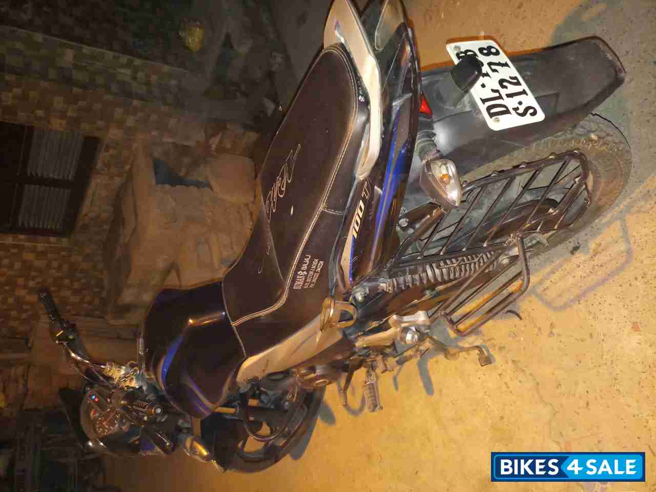 Black-blue Bajaj Discover 100T