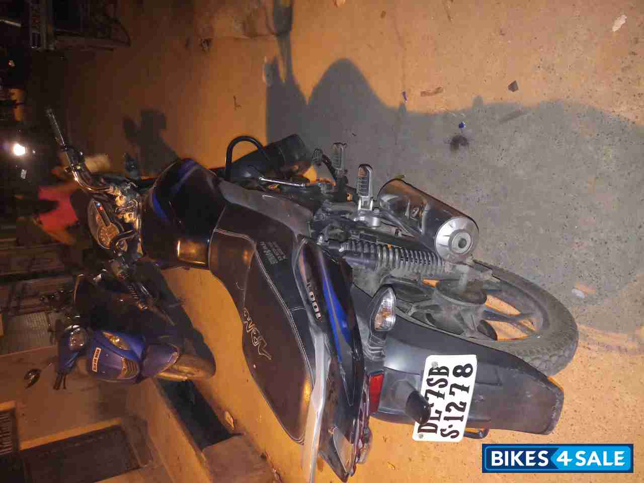 Black-blue Bajaj Discover 100T