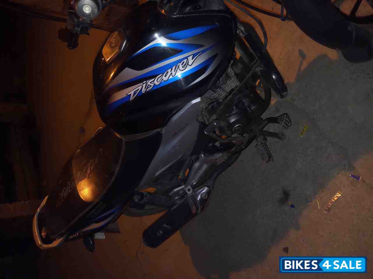 Black-blue Bajaj Discover 100T