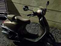 Brown Vespa VX 125