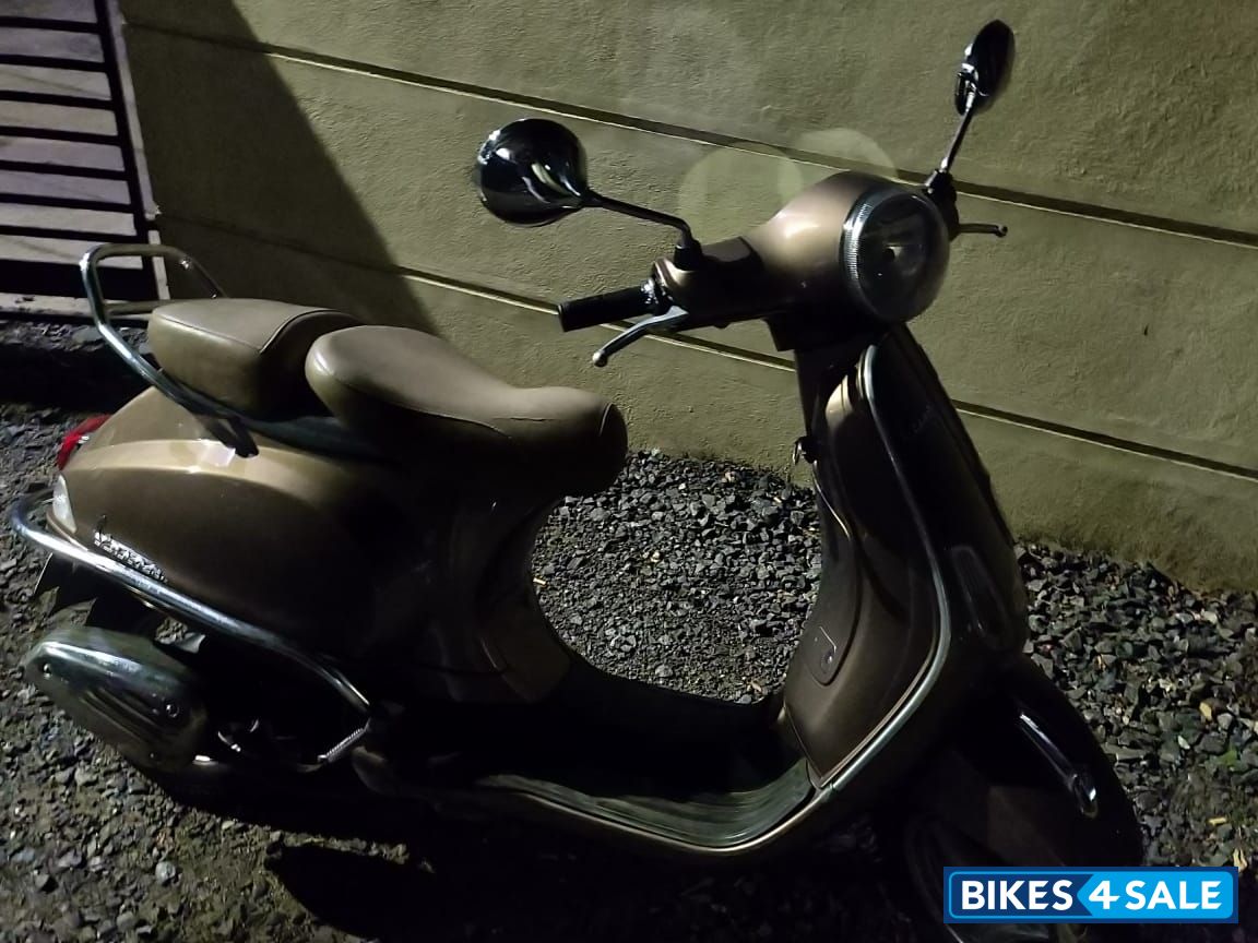 Brown Vespa VX 125