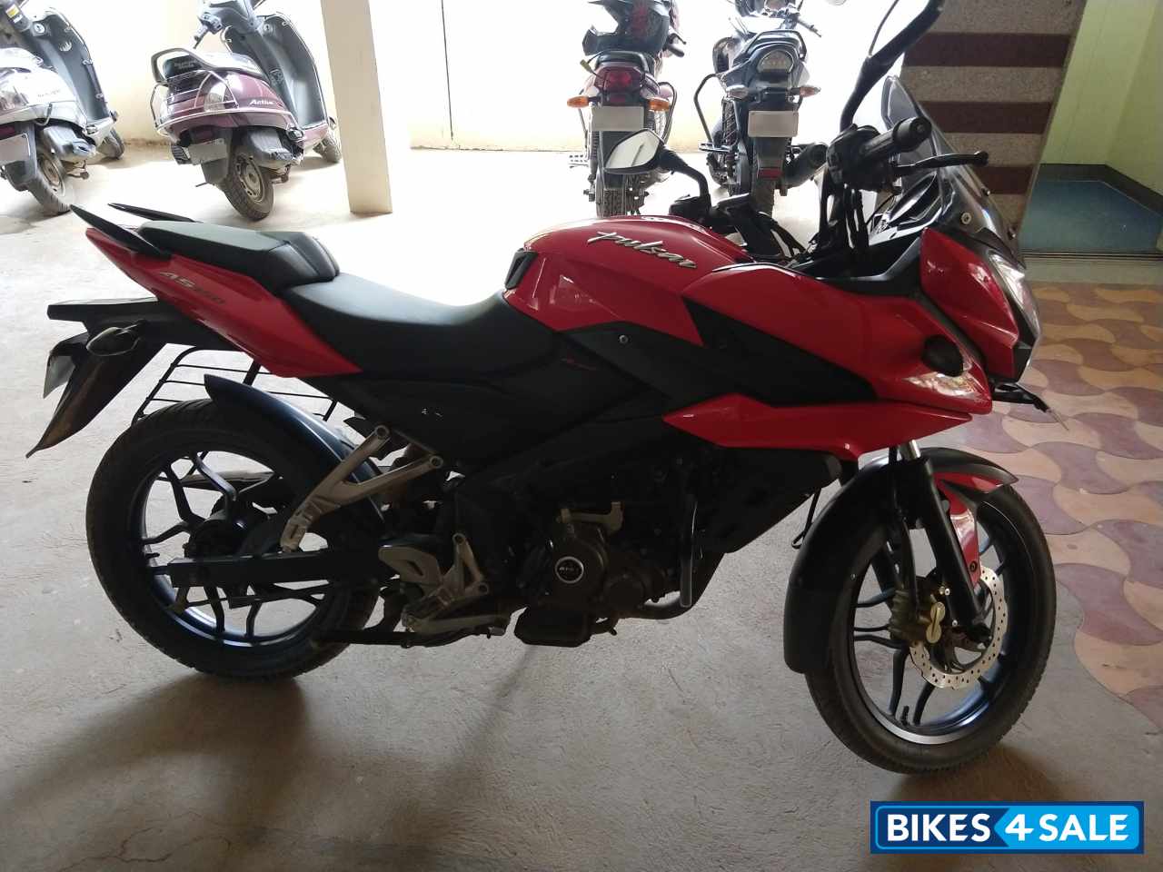 Red Bajaj Pulsar AS 150