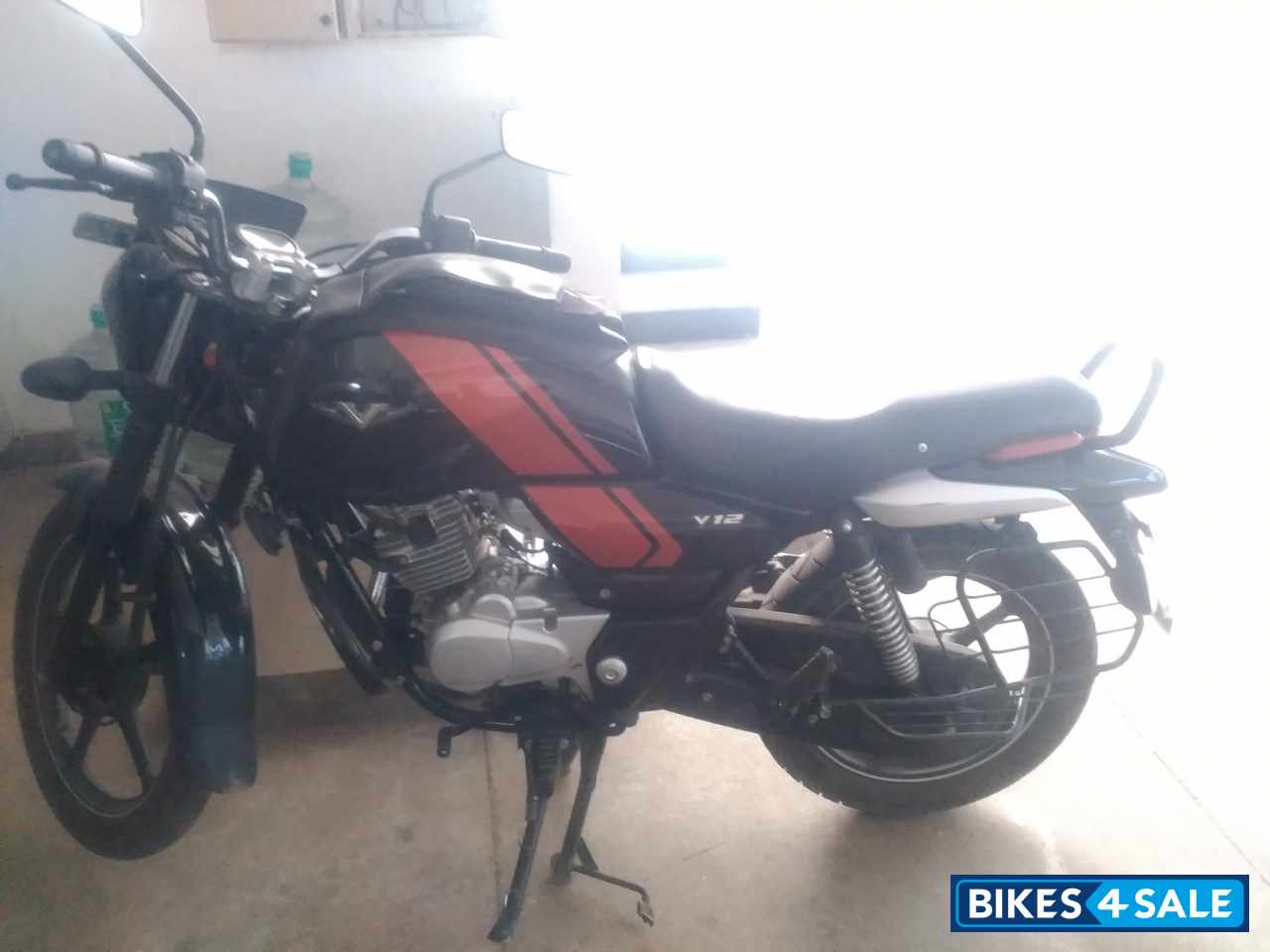 Black And Orange Bajaj V12