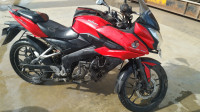 Red Bajaj Pulsar AS 150