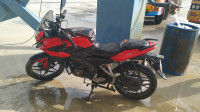 Red Bajaj Pulsar AS 150