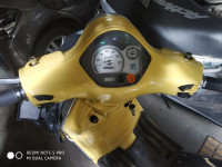Yellow Vespa LX 125