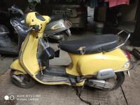 Yellow Vespa LX 125