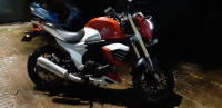 Red & White Mahindra Mojo
